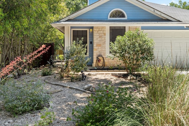 10730 N Platt River Dr, Austin, TX 78748 - view of front of property with a garage, stone siding, and roof with shingles