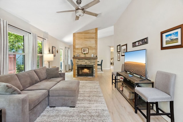 10730 N Platt River Dr, Austin, TX 78748 - living room with high vaulted ceiling, a ceiling fan, light wood-style floors, plenty of natural light, and a fireplace