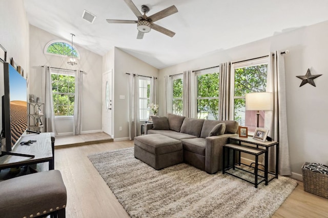 10730 N Platt River Dr, Austin, TX 78748 - living room featuring lofted ceiling, healthy amount of natural light, wood finished floors, ceiling fan, and baseboards