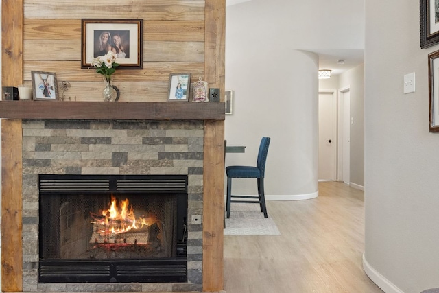 10730 N Platt River Dr, Austin, TX 78748 - detailed view of a fireplace, wood finished floors, and baseboards