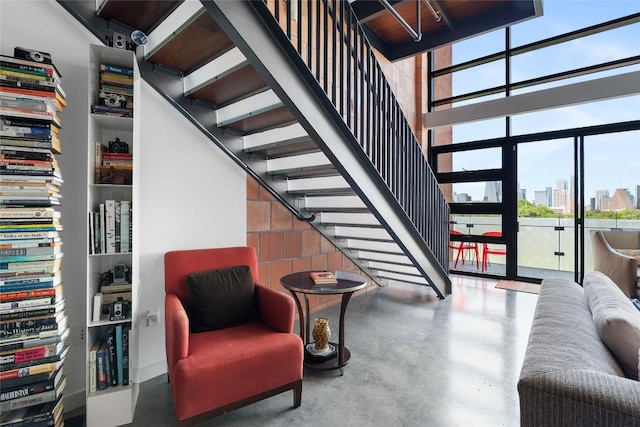 1401 Eva St Unit 406, Austin, TX 78704 - stairway with a city view, finished concrete floors, and a high ceiling