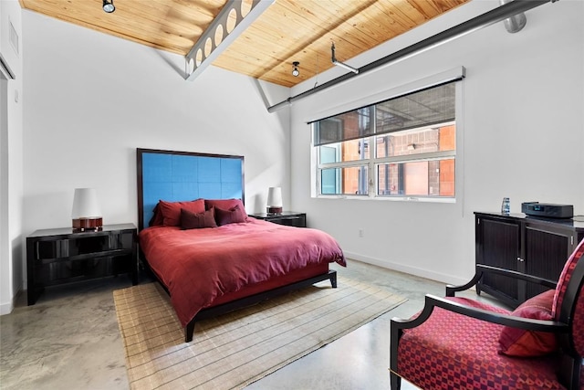 1401 Eva St Unit 406, Austin, TX 78704 - bedroom featuring concrete flooring, wooden ceiling, and baseboards