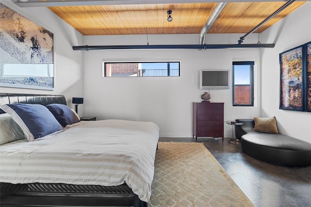 1401 Eva St Unit 406, Austin, TX 78704 - bedroom with wood ceiling with exposed beams and concrete flooring