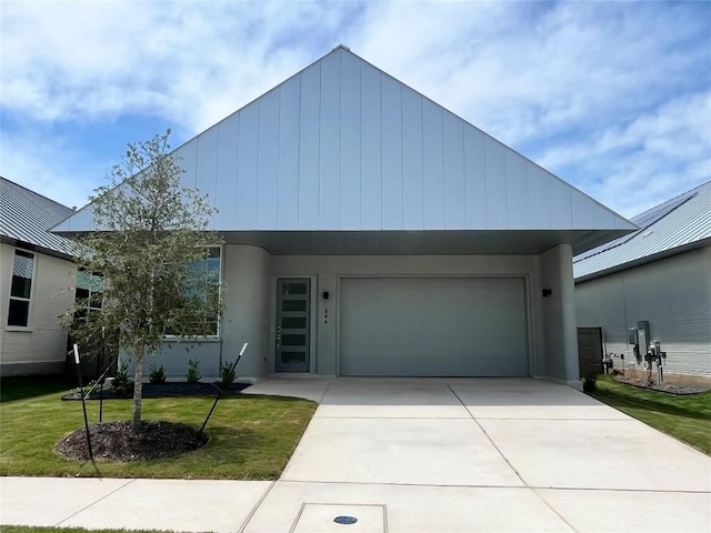 204 Blue Blaze Trl, Georgetown, TX 78628 - view of front of house featuring driveway, a front lawn, and stucco siding