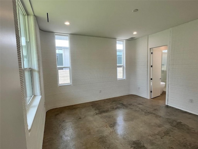 204 Blue Blaze Trl, Georgetown, TX 78628 - empty room with unfinished concrete flooring and recessed lighting