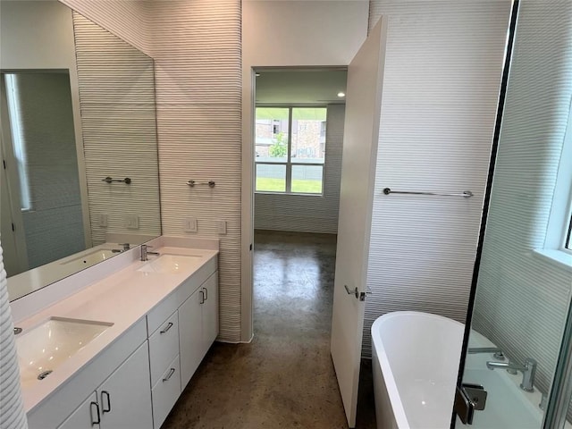 204 Blue Blaze Trl, Georgetown, TX 78628 - full bath featuring concrete flooring, a freestanding bath, and double vanity