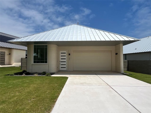221 Blue Blaze Trl, Georgetown, TX 78628 - view of front of house featuring a standing seam roof, metal roof, driveway, and an attached garage