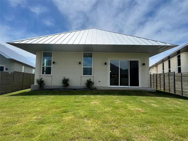 221 Blue Blaze Trl, Georgetown, TX 78628 - back of property featuring a standing seam roof and metal roof