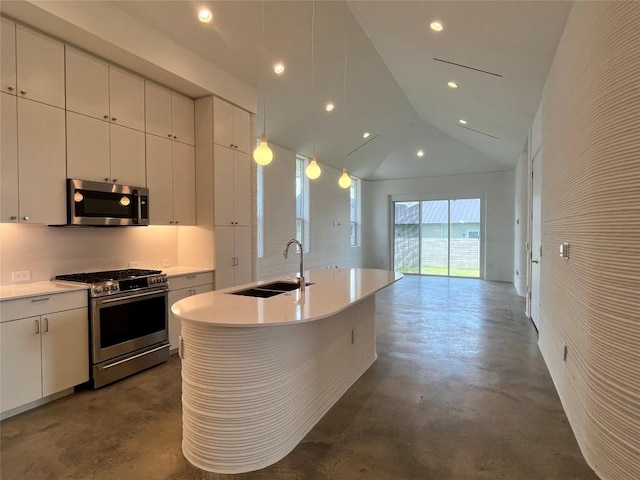 221 Blue Blaze Trl, Georgetown, TX 78628 - kitchen featuring appliances with stainless steel finishes, a sink, concrete floors, vaulted ceiling, and light countertops