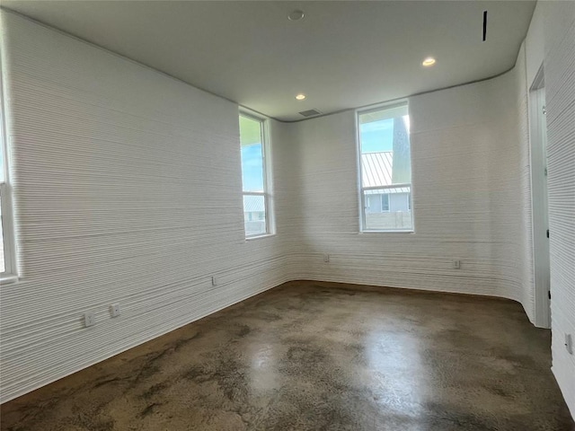 221 Blue Blaze Trl, Georgetown, TX 78628 - spare room featuring finished concrete floors and recessed lighting
