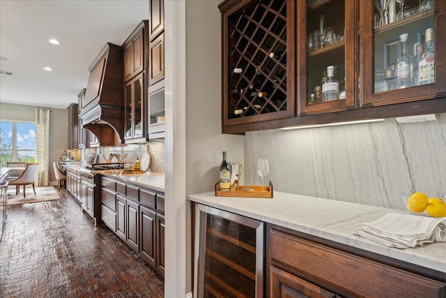 457 Santaluz Ln, Austin, TX 78732 - indoor dry bar featuring wine cooler, stainless steel range, decorative backsplash, recessed lighting, and dark wood-type flooring