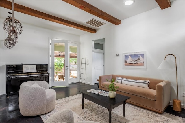 living area featuring beamed ceiling, baseboards, and recessed lighting
