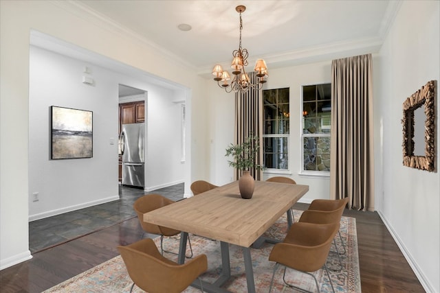 dining room with a chandelier, crown molding, baseboards, and dark wood-type flooring