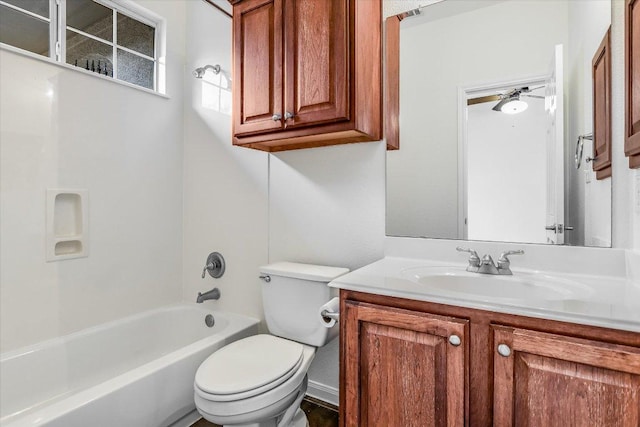 full bathroom featuring toilet, vanity, and  shower combination
