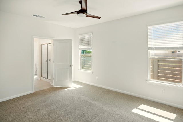 210 Weaver Ln, Bastrop, TX 78602 - unfurnished bedroom featuring carpet floors, baseboards, and a ceiling fan