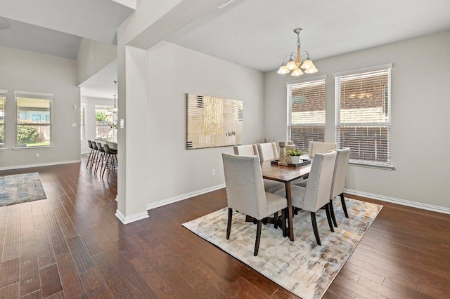 433 Vista Portola Loop, Liberty Hill, TX 78642 - dining space with a chandelier, baseboards, and wood finished floors