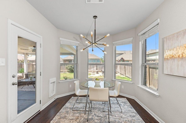 433 Vista Portola Loop, Liberty Hill, TX 78642 - dining space with a chandelier, healthy amount of natural light, and dark wood finished floors