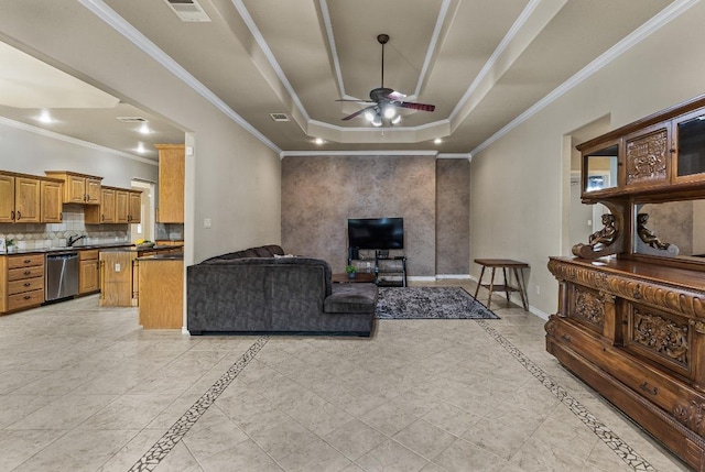 1420 Gomer Ln, Harker Heights, TX 76548 - living room featuring ceiling fan, inlaid floor details, a tray ceiling, and crown molding