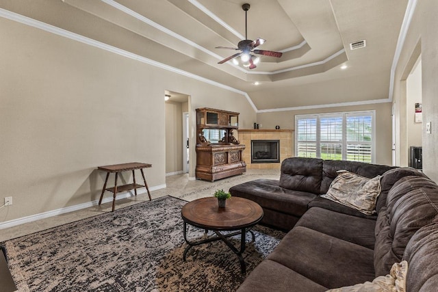 1420 Gomer Ln, Harker Heights, TX 76548 - living room with ceiling fan, crown molding, a fireplace, and a raised ceiling