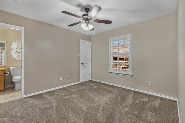 1420 Gomer Ln, Harker Heights, TX 76548 - unfurnished bedroom featuring light colored carpet, connected bathroom, and ceiling fan