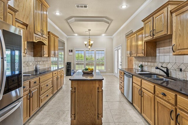 1420 Gomer Ln, Harker Heights, TX 76548 - kitchen with refrigerator, stainless steel dishwasher, a center island, black electric stovetop, and brown cabinetry