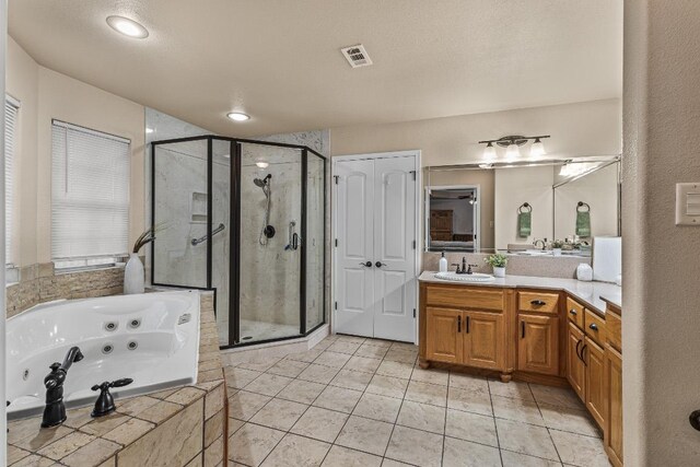 1420 Gomer Ln, Harker Heights, TX 76548 - bathroom with a stall shower, vanity, a whirlpool tub, and tile patterned floors