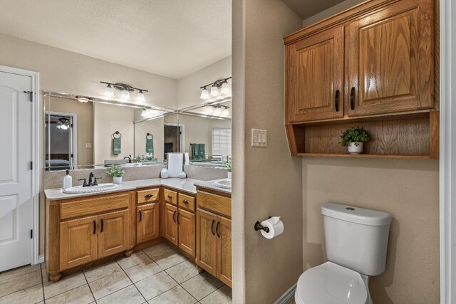 1420 Gomer Ln, Harker Heights, TX 76548 - bathroom featuring double vanity, tile patterned floors, and toilet