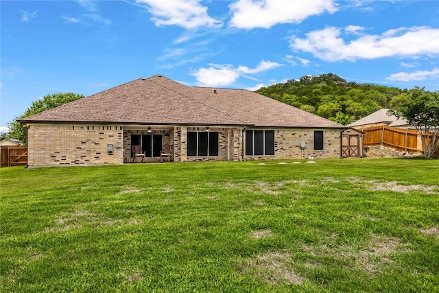 1420 Gomer Ln, Harker Heights, TX 76548 - rear view of house with a storage unit, brick siding, and a fenced backyard