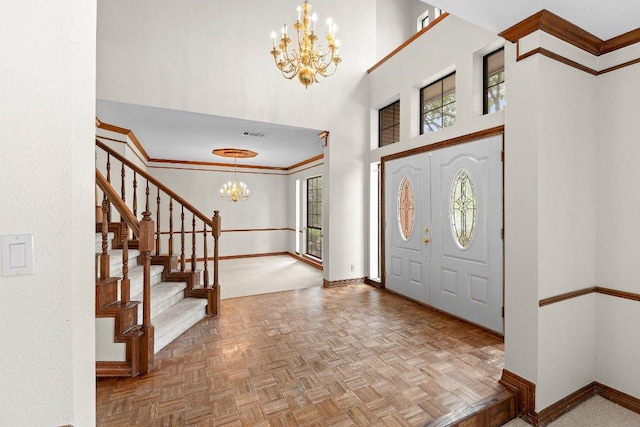 9002 Scotsman Dr, Austin, TX 78750 - foyer entrance featuring a chandelier, baseboards, stairs, and a high ceiling