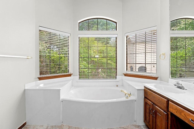 9002 Scotsman Dr, Austin, TX 78750 - bathroom featuring a garden tub and vanity