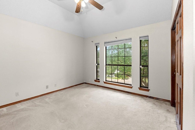 9002 Scotsman Dr, Austin, TX 78750 - empty room featuring carpet flooring, a ceiling fan, lofted ceiling, and baseboards