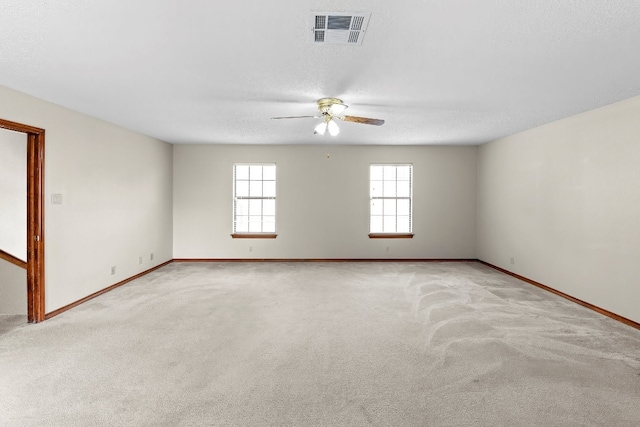9002 Scotsman Dr, Austin, TX 78750 - empty room with a ceiling fan, baseboards, and light carpet