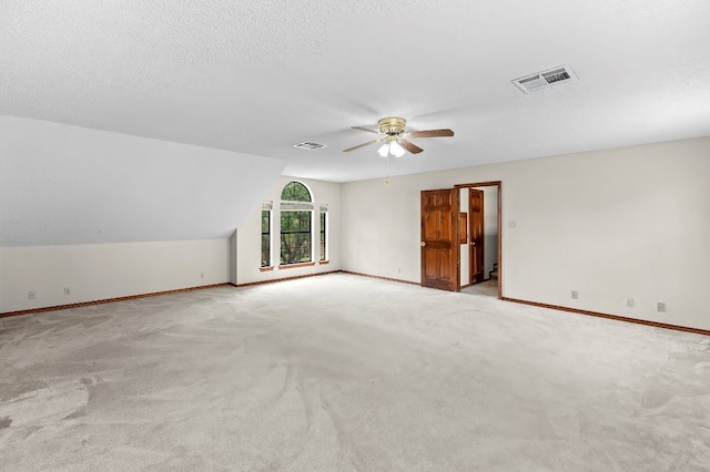 9002 Scotsman Dr, Austin, TX 78750 - empty room with baseboards, a ceiling fan, carpet, and vaulted ceiling