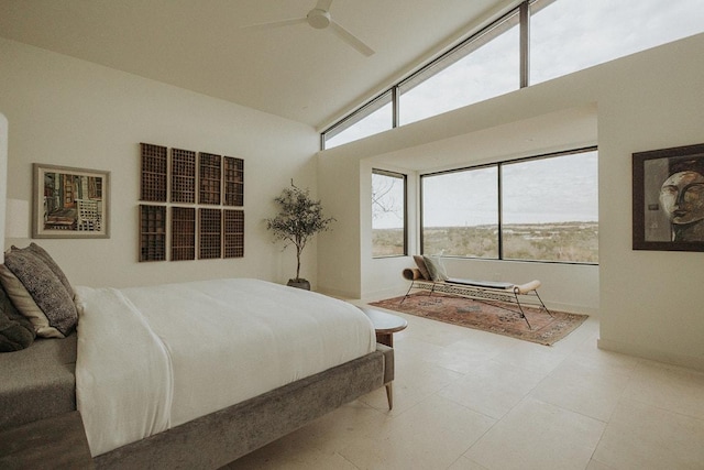 bedroom featuring high vaulted ceiling and a ceiling fan