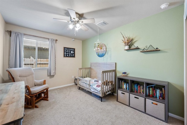 109 Dickinson Bayou Cv, Hutto, TX 78634 - bedroom with carpet, baseboards, a nursery area, and ceiling fan