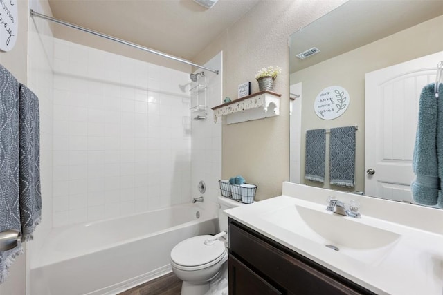 109 Dickinson Bayou Cv, Hutto, TX 78634 - full bath with toilet, vanity,  shower combination, and wood finished floors