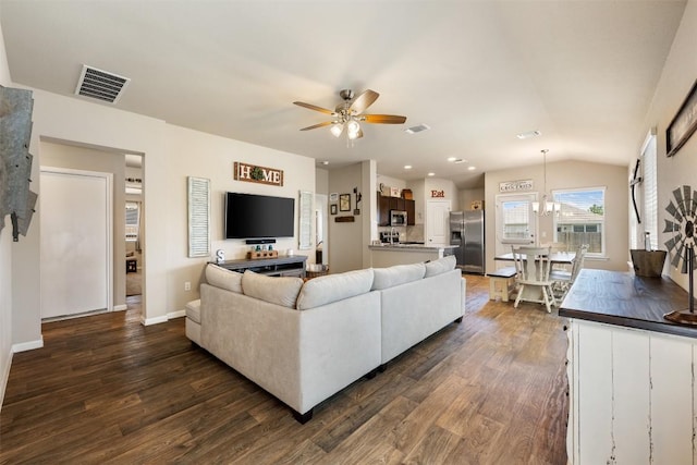109 Dickinson Bayou Cv, Hutto, TX 78634 - living area featuring a ceiling fan, dark wood-style flooring, baseboards, and vaulted ceiling