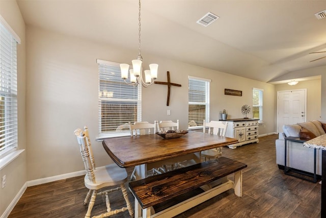 109 Dickinson Bayou Cv, Hutto, TX 78634 - dining space featuring a chandelier, dark wood-style floors, baseboards, vaulted ceiling, and ceiling fan