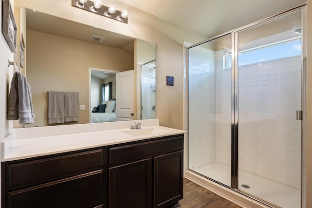 109 Dickinson Bayou Cv, Hutto, TX 78634 - ensuite bathroom featuring a shower stall, wood finished floors, and vanity