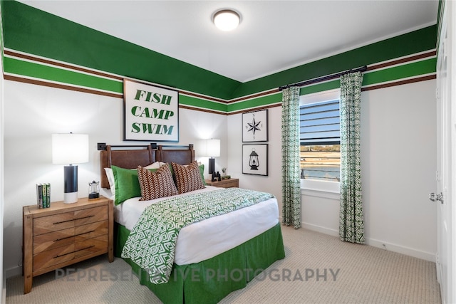 bedroom with carpet floors and baseboards