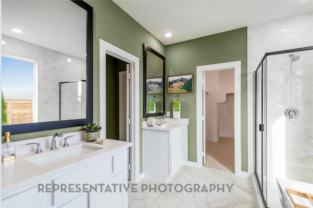 bathroom with a shower stall, marble finish floors, baseboards, and two vanities