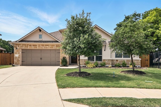 view of front facade featuring stucco siding, stone siding, concrete driveway, and an attached garage