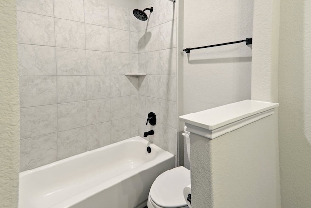 full bathroom featuring toilet, bathtub / shower combination, and a textured wall