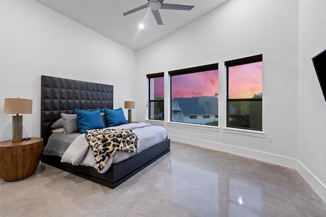 bedroom featuring high vaulted ceiling, baseboards, a ceiling fan, and concrete floors
