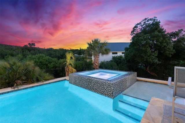 outdoor pool featuring an in-ground hot tub