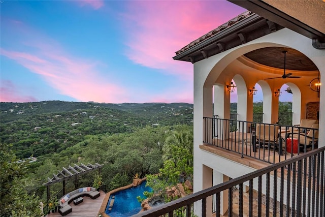 1710 Mount Larson Rd, Austin, TX 78746 - balcony at dusk featuring view of pool