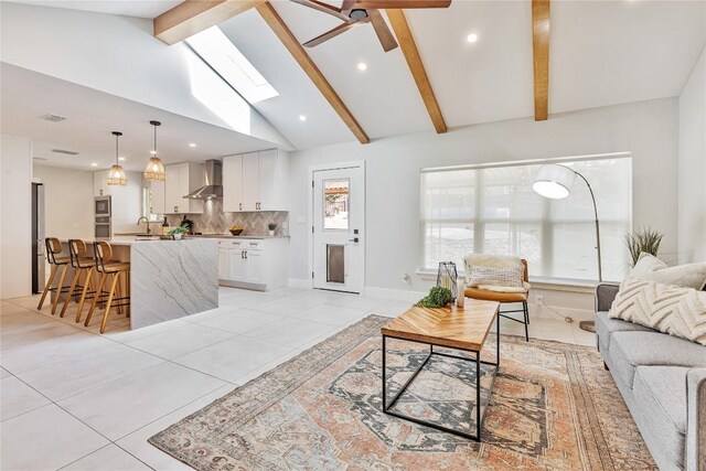 7000 Scenic Brook Dr, Austin, TX 78736 - living area with light tile patterned floors, beam ceiling, ceiling fan, recessed lighting, and high vaulted ceiling
