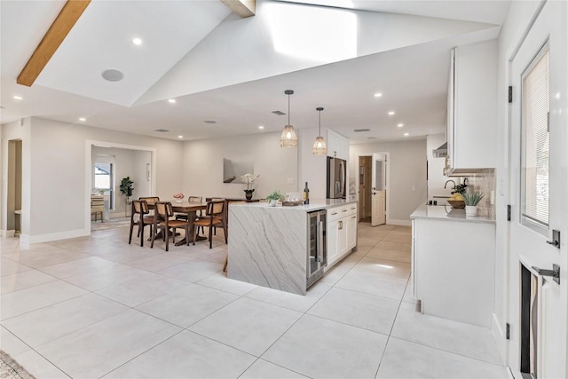 7000 Scenic Brook Dr, Austin, TX 78736 - kitchen featuring stainless steel fridge, beverage cooler, light tile patterned floors, white cabinets, and recessed lighting