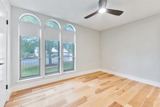 7000 Scenic Brook Dr, Austin, TX 78736 - spare room featuring wood finished floors, a ceiling fan, and baseboards