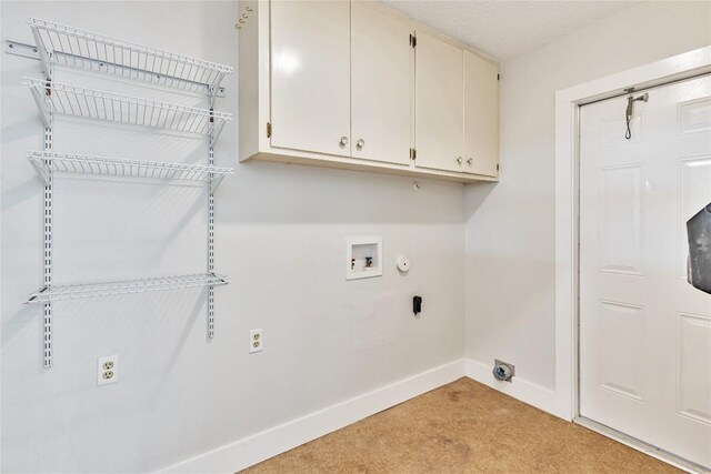 7000 Scenic Brook Dr, Austin, TX 78736 - laundry area featuring cabinet space, light carpet, washer hookup, baseboards, and electric dryer hookup